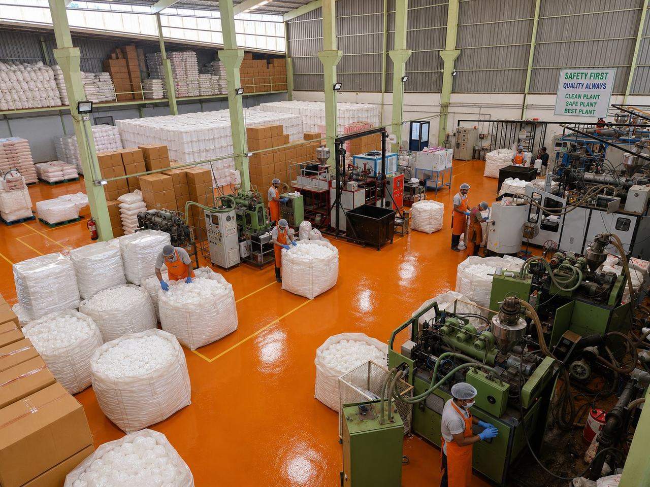 Production hall with HDPE bottles being checked and packed